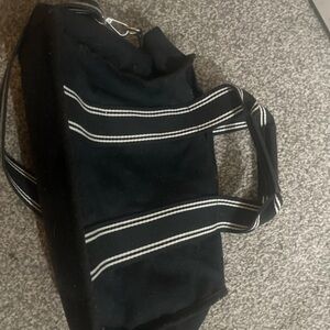 Sleek Black Bag with Striped Handles